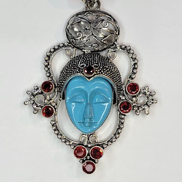 Sterling Silver Pendant with Blue Carved Face and Garnet Accents - Picture 2 of 12